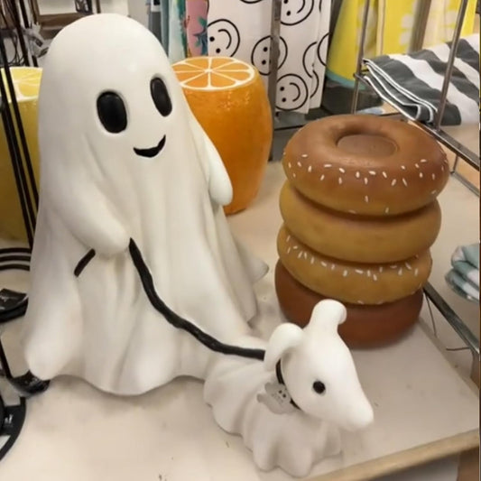 Cute ghost walking dog statue